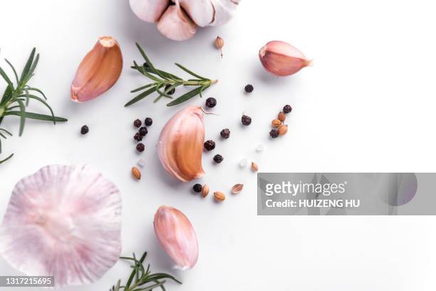 garlic and herbs on white background - garlic ストックフォトと画像