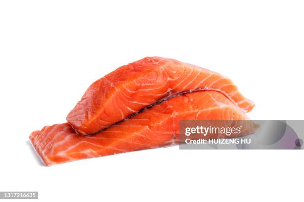 fresh raw salmon fillets isolated on white background - salmon steak stockfoto's en -beelden