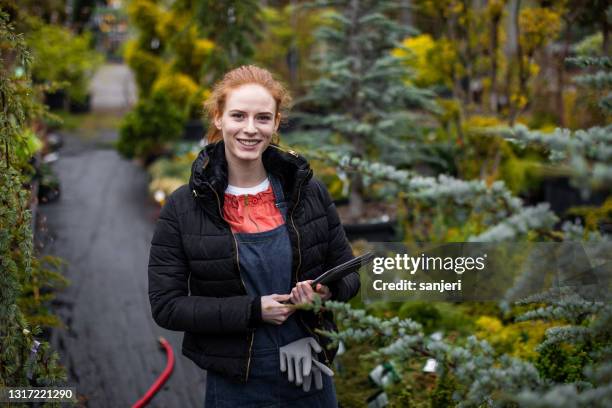 portrait of a garden center worker - landscape gardener stock pictures, royalty-free photos & images
