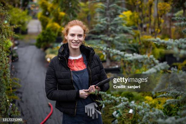 portrait of a garden center worker - landscape architect stock pictures, royalty-free photos & images