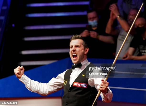 Mark Selby of England celebrates victory during the Final between Shaun Murphy and Mark Selby on day seventeen of the Betfred World Snooker...
