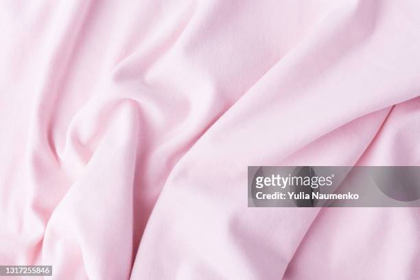 jersey fabric texture as background - pink jersey stock-fotos und bilder