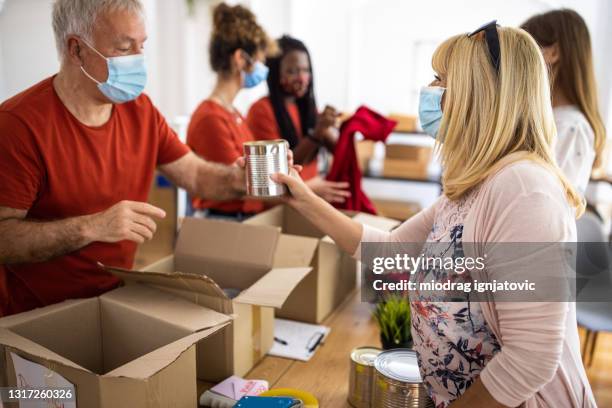 Masked Generosity Mask Handout Photos and Premium High Res Pictures - Getty Images