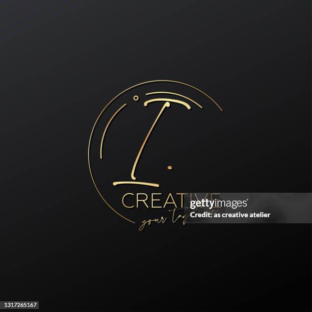 i letter calligraphy minimal monogram emblem style vector logo. gold color and black background. - i letter logo stock illustrations