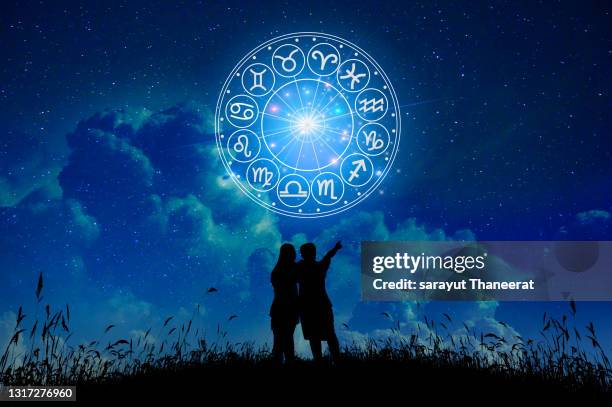 lovers stand in the stars zodiac signs inside of horoscope circle. astrology in the sky with many stars and moons  astrology and horoscopes concept - moonlight lovers stock pictures, royalty-free photos & images