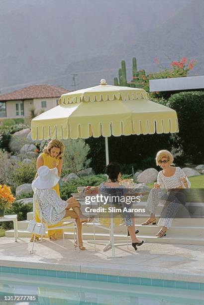 Nelda Linsk , wife of art dealer Joseph Linsk with guests by the pool at the Linsk's desert house in Palm Springs, January 1970. At far left in white...