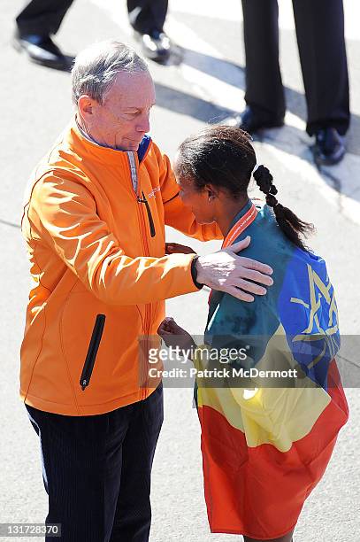 New York City Mayor Michael Bloomberg talks with Firehiwot Dado of Ethiopia after she won the Women's Division of the 42nd ING New York City Marathon...