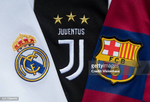 The club badges of the three remaining clubs in the European Super League Real Madrid, Juventus and Barcelona on their first team home shirts on May...