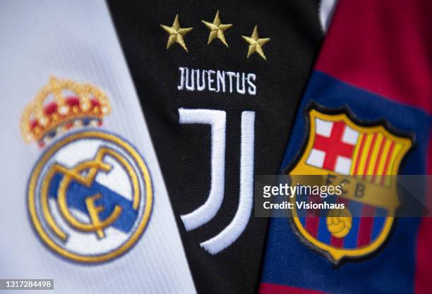 The club badges of the three remaining clubs in the European Super League Real Madrid, Juventus and Barcelona on their first team home shirts on May...