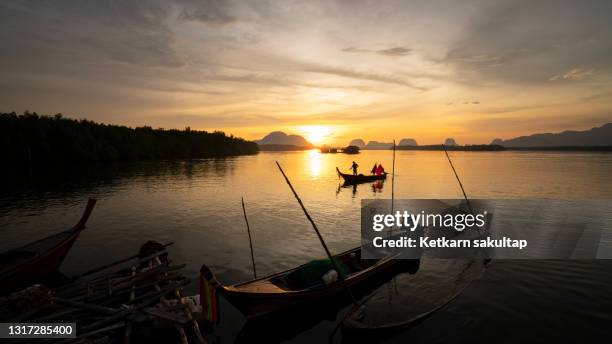 fisherman's daily life at baan sam chong fishing village, phangnga bay. - indian ocean stock pictures, royalty-free photos & images