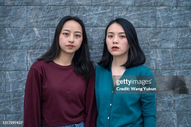 close up of two east asian women - east asian ethnicity fotografías e imágenes de stock