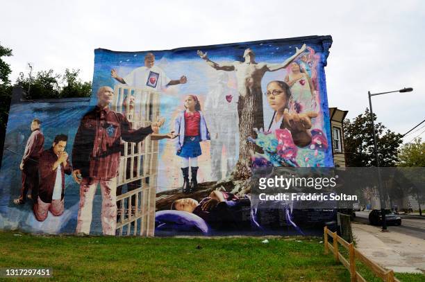 Mural in a black district, illustrating victims and their murderers, painted within the "Mural Art Program" which began in 1984. It's an...