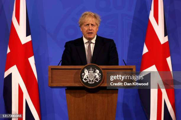 Britain's Prime Minister Boris Johnson attends a virtual press conference to announce changes to lockdown rules in England at Downing Street on May...