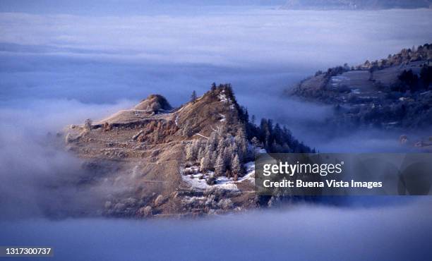 first snow on a hill in fog - rhone valley stock pictures, royalty-free photos & images