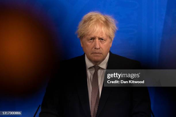 Britain's Prime Minister Boris Johnson attends a virtual press conference to announce changes to lockdown rules in England at Downing Street on May...