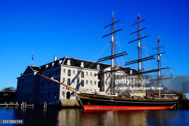 scheepvaart museum in the sunshine, amsterdam, the netherlands - scheepvaart stock pictures, royalty-free photos & images