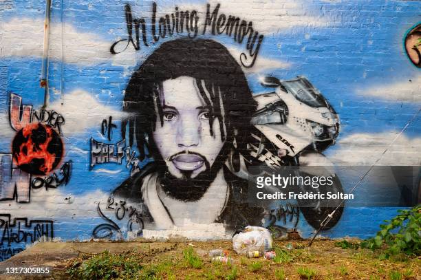 Mural in a black district, painted within the "Mural Art Program" which began in 1984. It's an anti-graffiti program in a city economically...