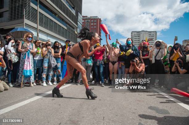 And transgender demonstrators dance in form of protest in Bogota, Colombia on May 9 2021, as peaceful demonstrarions against police brutality had...