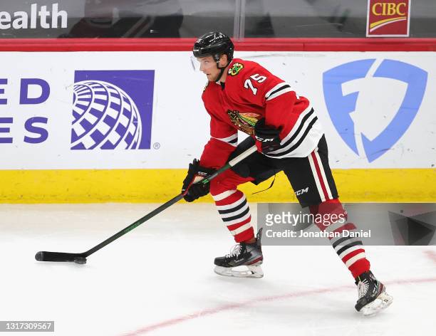 Alec Regula of the Chicago Blackhawks advances the puck against the the Dallas Stars at the United Center on May 09, 2021 in Chicago, Illinois. The...