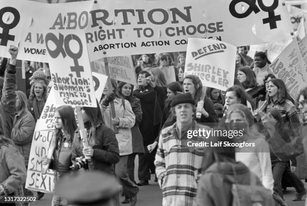 View of pro-Choice demonstrators, may with signs, as they march on Pennsylvania Avenue, Washington DC, November 20, 1970. Among the visible signs are...