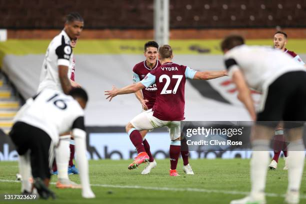 Ashley Westwood of Burnley celebrates with Matej Vydra after scoring their team's first goal during the Premier League match between Fulham and...