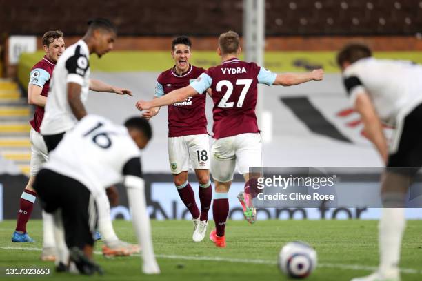 Ashley Westwood of Burnley celebrates with Matej Vydra after scoring their team's first goal during the Premier League match between Fulham and...