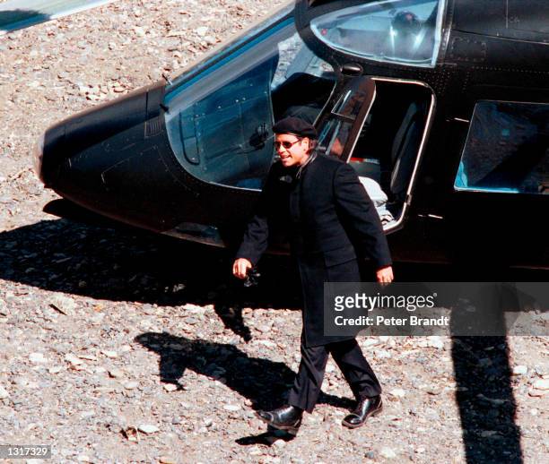 Actor John Travolta films a scene from his new movie, "Swordfish" in this undated photo taken in February 2001 in Medford, OR. Travolta plays Gabriel...