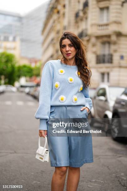 Ketevan Giorgadze @katie.one wears a sky blue knit wool jumper sweater pullover with long balloon sleeves and embroiled daisies from Manoush, vegan...