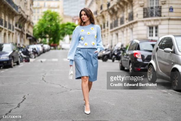 Ketevan Giorgadze @katie.one wears a sky blue knit wool jumper sweater pullover with long balloon sleeves and embroiled daisies from Manoush, vegan...
