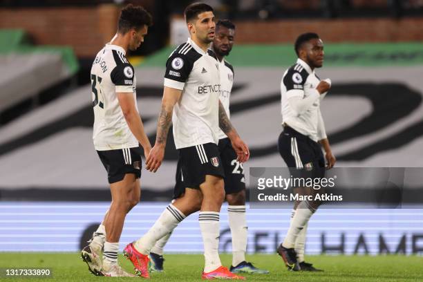 Antonee Robinson and Aleksandar Mitrovic of Fulham look dejected as they are relegated from the Premier League following their team's defeat in the...