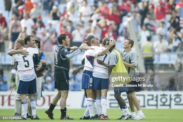 John O'Brien, Bruce Arena , Tony Meola, Earnie Stewart , Eddie Pope, Eddie Lewis, Damarcus Beasley and Frankie Hejduk of the USA celebrate at the end...