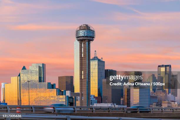 view of skyscrapers against cloudy sky - dallas texas bildbanksfoton och bilder