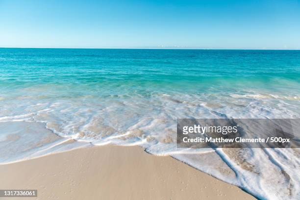 scenic view of sea against clear blue sky,grace bay,turks and caicos islands - turks and caicos islands stock pictures, royalty-free photos & images