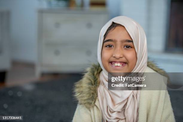 happy, young muslim girl - refugee education stock pictures, royalty-free photos & images