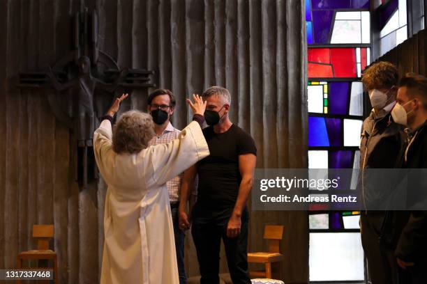 Brigitte Schmidt, a pastoral worker blesses a same-sex couple, Ralf Michael Berger and Andreas Helfrich, at the Catholic St. Johannes XXIII church on...