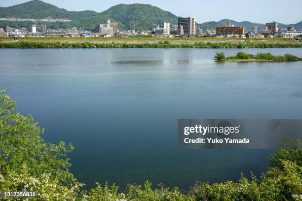 riverside view in hiroshima, japan - 河川敷 ストックフォトと画像