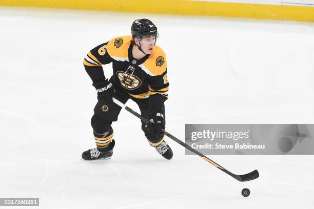 Mike Reilly of the Boston Bruins skates with the puck against the New York Islanders at the TD Garden on May 10, 2021 in Boston, Massachusetts.