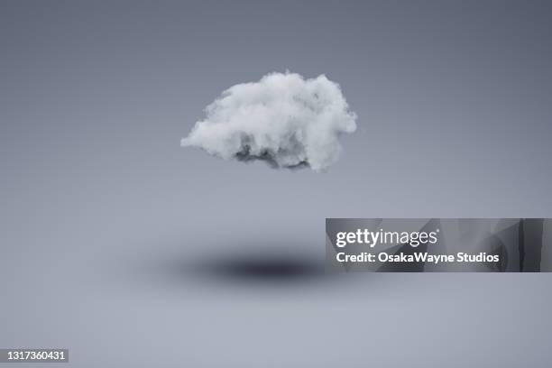 single fluffy cloud making dark shadow on surface bellow. - depresión fotografías e imágenes de stock