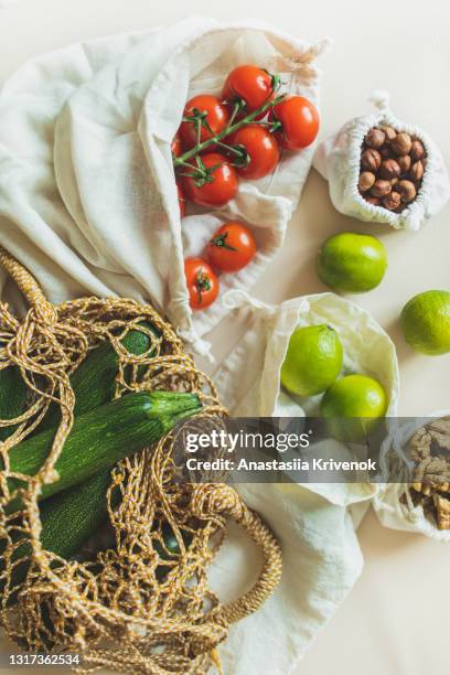 eco friendly natural bag with organic nuts and vegetables. - biologia imagens e fotografias de stock