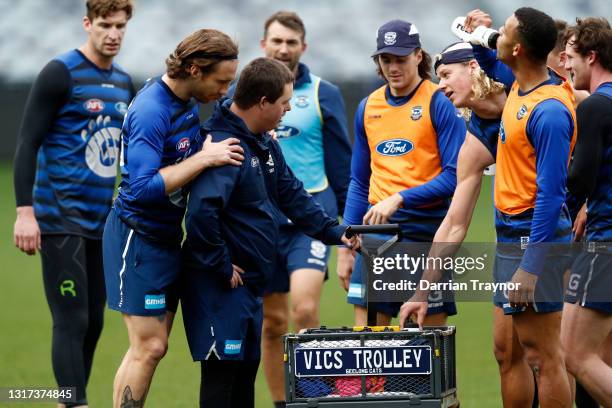 Geelong Cats players get a drink during a Geelong Cats AFL media opportunity at GMHBA Stadium on May 11, 2021 in Geelong, Australia.