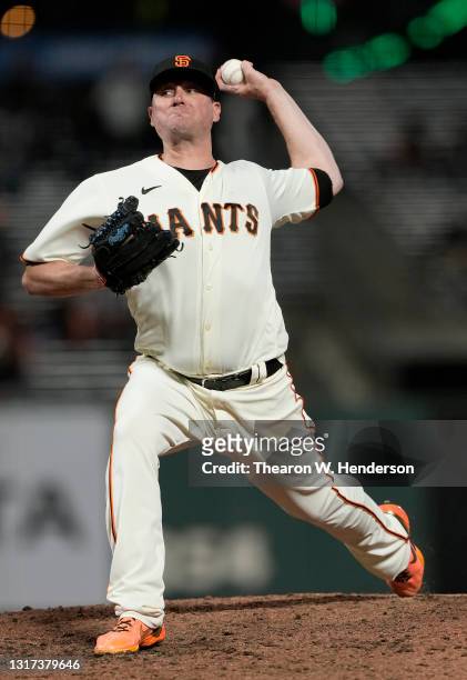 Jake McGee of the San Francisco Giants pitches against the Texas Rangers in the ninth inning at Oracle Park on May 10, 2021 in San Francisco,...
