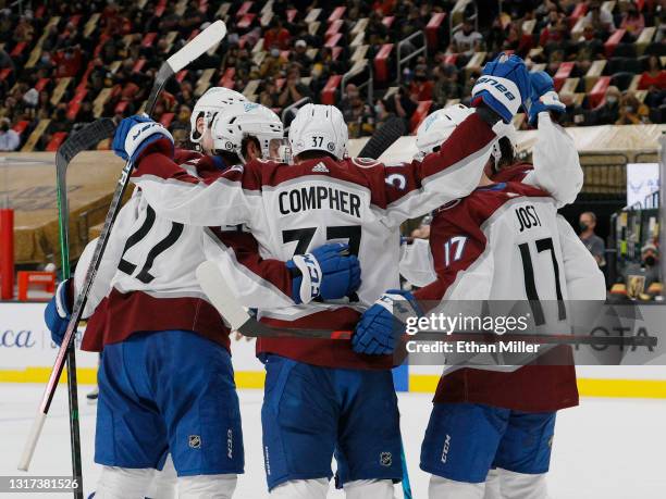 The Colorado Avalanche celebrate a third-period goal by J.T. Compher of the Colorado Avalanche against the Vegas Golden Knights during their game at...