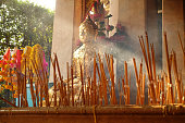 Incense in joss stick pot with Buddha statue to make a wish in the temple Thailand,Incense that was lit to worship,Make merit for Temple Thailand (Visakha Puja Day,Asalha Puja Day,Magha Puja Day)