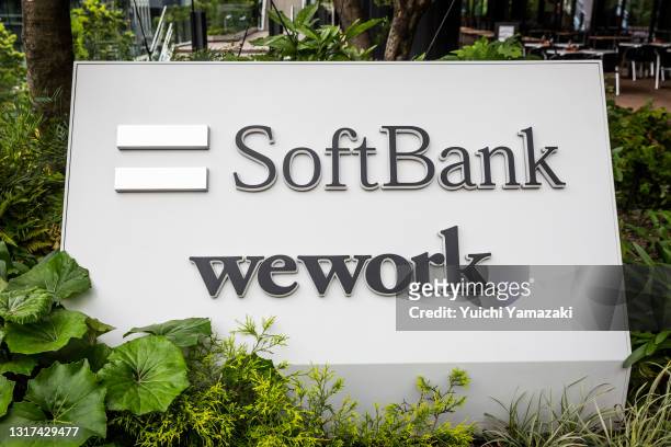 Signage for SoftBank Corp. And WeWork Companies Inc. Outside the Tokyo Portcity Takeshiba building, which houses SoftBank Group's headquarters, on...