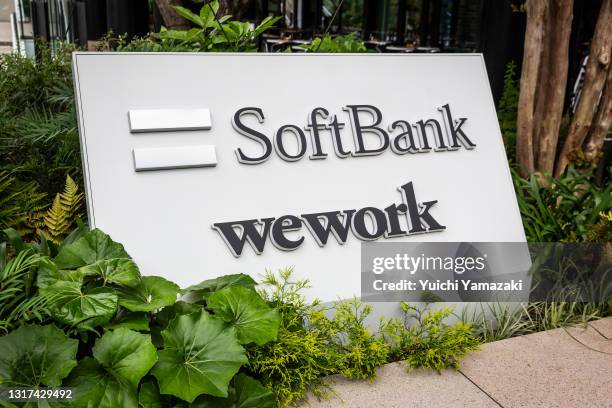 Signage for SoftBank Corp. And WeWork Companies Inc. Outside the Tokyo Portcity Takeshiba building, which houses SoftBank Group's headquarters, on...