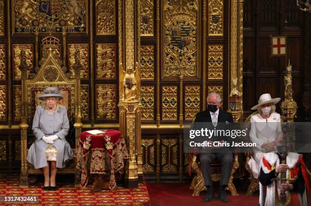 Queen Elizabeth II in the House of Lord's Chamber with Prince Charles, Prince of Wales and Camilla, Duchess of Cornwall seated during the State...