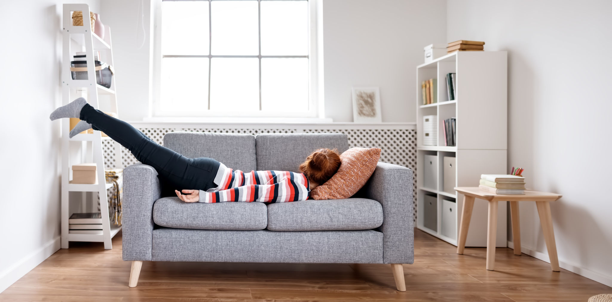 Tired woman lying on the sofa after hard day. Tired woman lying on the sofa after hard day.
