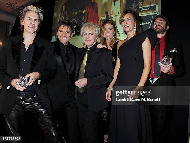 John Taylor, Roger Taylor, Nick Rhodes, Eva Herzigova, Yasmin Le Bon and Simon Le Bon accept the Fashion Icons of the Year award at the Harper's...