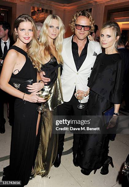 Poppy Delevinge, Emilio Pucci creative director Peter Dundas, Laura Bailey and Katie Readman attend the Harper's Bazaar Women Of The Year Awards in...