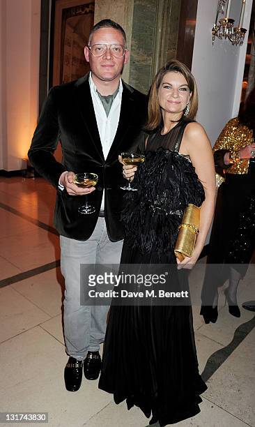 Giles Deacon and Natalie Massenet attend the Harper's Bazaar Women Of The Year Awards at Claridges Hotel on November 7, 2011 in London, England.